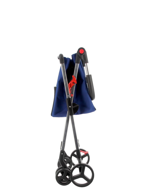 Carrito de la compra plegado con bolsa azul, chasis metálico y ruedas triples negras con detalles rojos.
